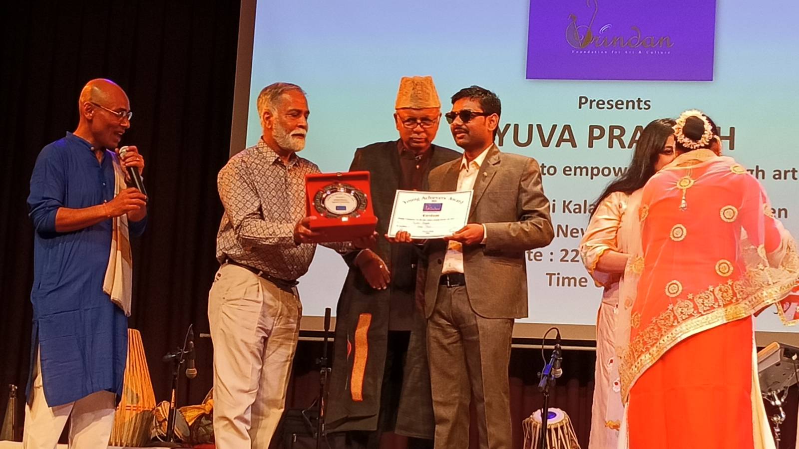 Rajeev being facilitated for his performance at an event