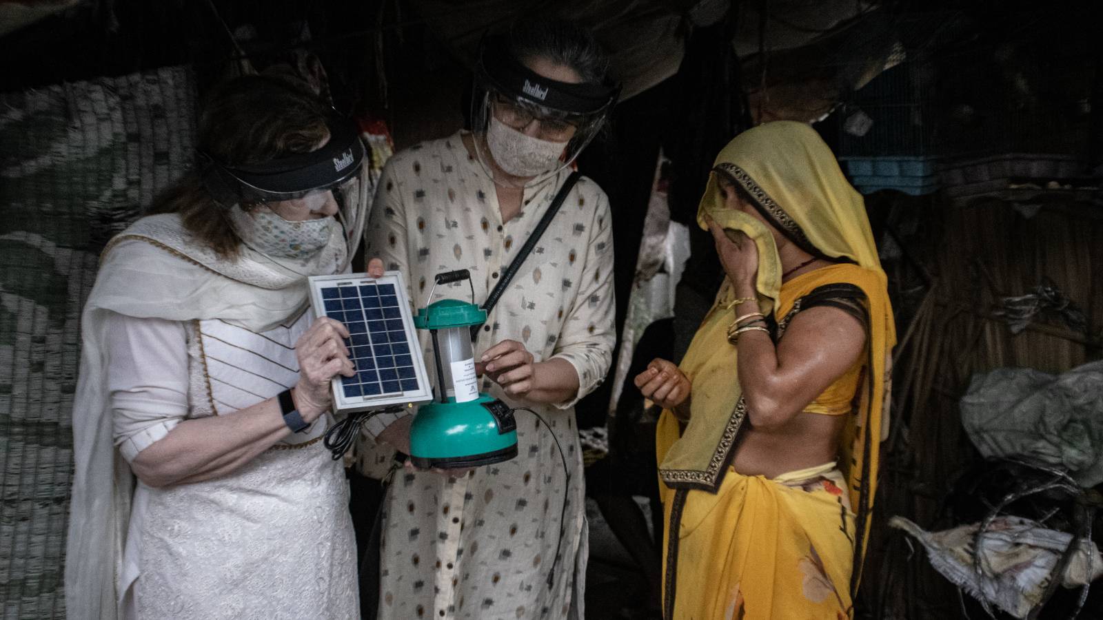 Our trustees distributing Solar Lamps to the unreached population.