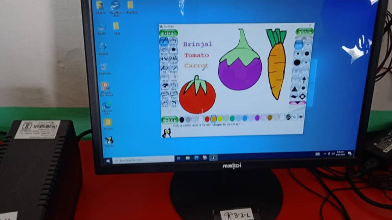 Students engaging with Canva, GCompris, and Scratch Software